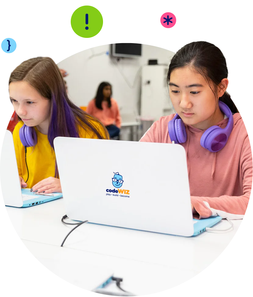 Two girls wearing purple headphones focus intently on coding on their laptops. TITLE: